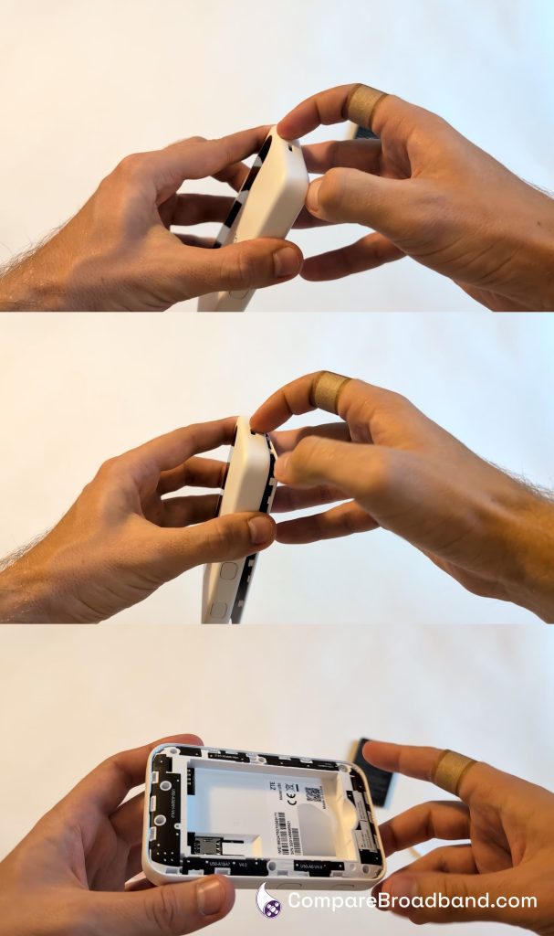 Removing the cover from a MiFi device.
